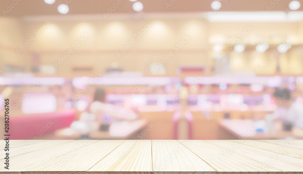 Obraz premium Empty wood table top with cafe restaurant interior blur background