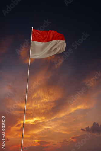 National flag of Indonesia in evening sky for holiday card design