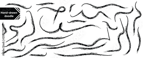 Collection of black hand drawn brush strokes and wavy line doodles isolated on a white background