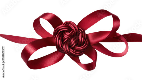 Slika na platnu Red satin ribbon bow knot with flowing tails