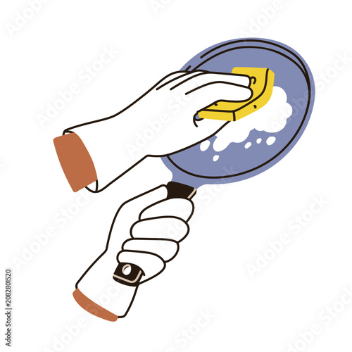 Dishwashing. Hands washing frying pan with sponge and soap foam. Dish cleanin...