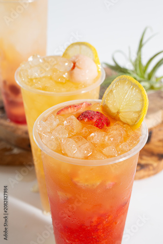 A view of a strawberry lemonade, among other fruit tea drinks.