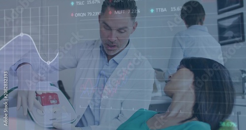 Dentist angling device toward patient in dental chair, showing use as animated data overlays appear