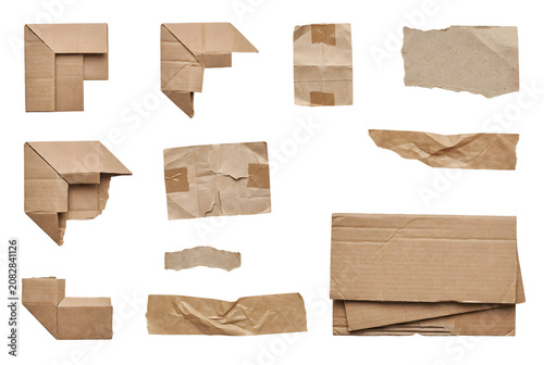 Various pieces of crumpled and folded brown cardboard in different shapes and sizes.