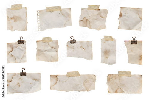 Collection of torn, crumpled, and taped pieces of paper with clips and tape on a white background.