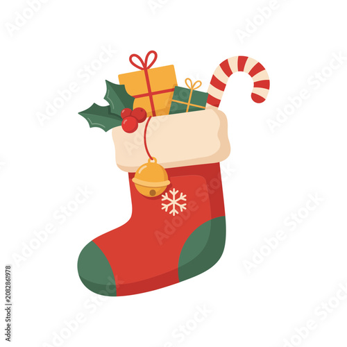 Festive christmas stocking with green trim and golden bell filled with wrapped gifts and candy cane for holiday season