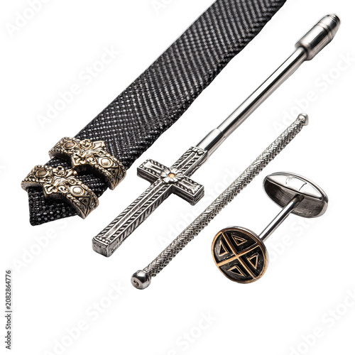 Formal accessories displayed on a black background. Includes tie, tie bar, cufflinks, and stickpin with intricate designs