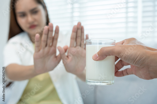Obraz na plátne Milk allergens, Sick sad unhealthy, woman confuse drink milk, runny stuffy sore nose suffer from intolerance allergy trigger symptoms