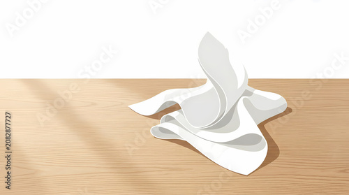 A crisp white fabric cloth resting elegantly on a smooth wooden table surface in soft natural morning sunlight