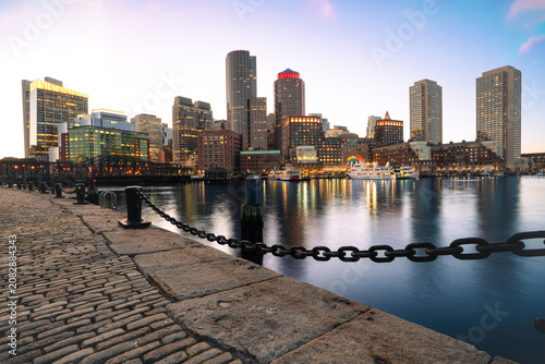 Title: Boston Skyline and Harbor at Twilight with Cobblestone Walkway Foreground