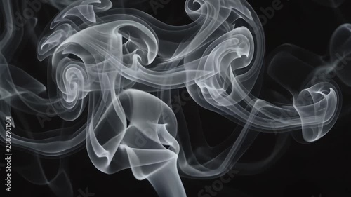 Ethereal white smoke swirling against a black background