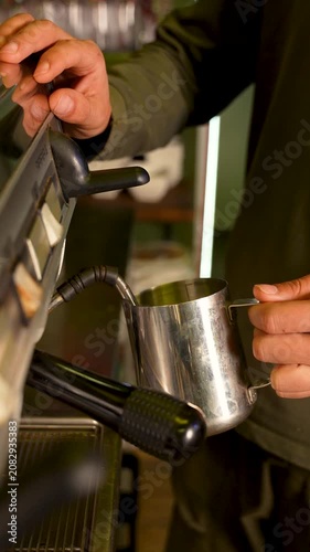 Barista Pouring Milk into Coffee