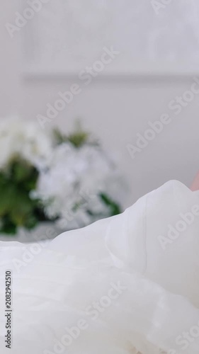 Attractive brunette bride in fashion wedding dress with professional makeup
