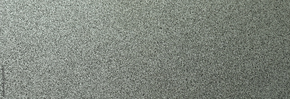 Fototapeta premium Terrazzo cement background with black and white stone grains scattered all over concrete floor