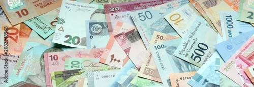 Quadro su tela Big amount of money bills of various currencies