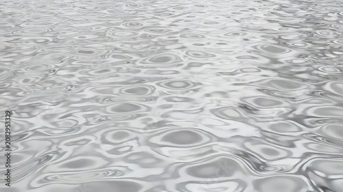 Static shot with organic liquid motion with grey reflections in calm water  