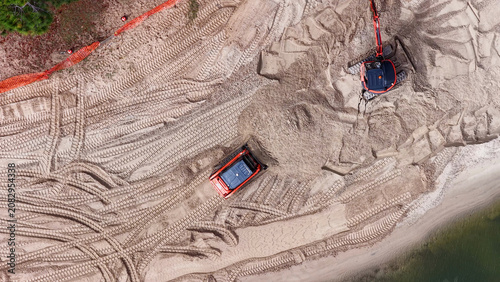 Top-Down Aerial View of Red Excavator and Bulldozer Moving Beach Sand