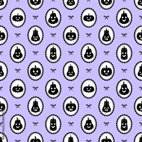 Seamless Halloween pumpkins pattern on purple backdrop.