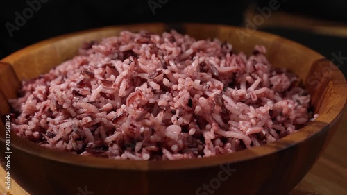 Cooked Riceberry Rice in a Wooden Bowl on a Wooden Table