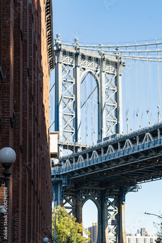 Washington Street in DUMBO, Brooklyn. Iconic Manhattan Bridge view between historic buildings. DUMBO neighborhood in Brooklyn.