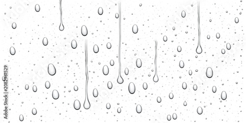 Quadro su tela Vertical streaks of heavy rain on a glass window with raindrops droplets condens