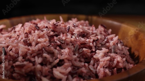 Cooked Riceberry Rice in a Wooden Bowl on a Wooden Table