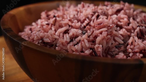 Cooked Riceberry Rice in a Wooden Bowl on a Wooden Table