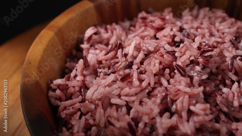 Cooked Riceberry Rice in a Wooden Bowl on a Wooden Table