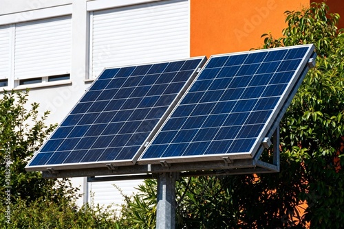 Solar panels on residential building with greenery