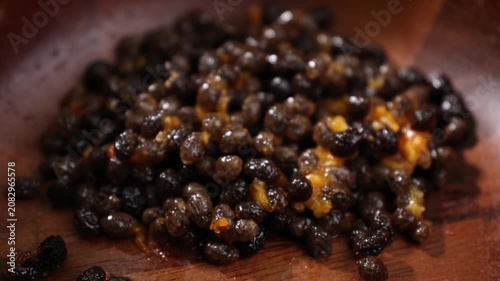 Ripe Papaya Seeds in a Wooden Bowl
