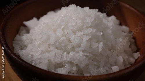 Dolly Shot of Natural Sea Salt in a Wooden Bowl