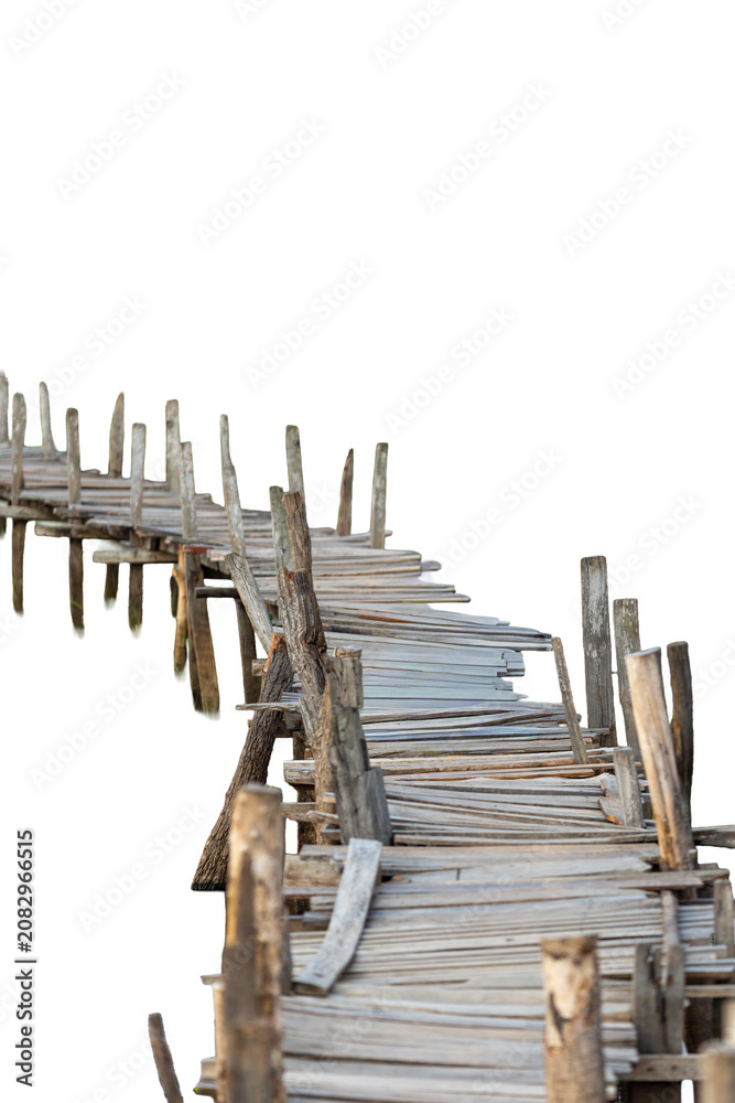 Fototapeta premium A long rickety and uneven handmade wooden bridge stretching out and isolated on a white background.