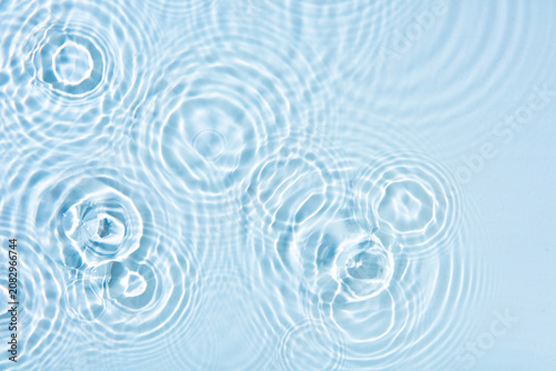 Top view of waterdrop dropping on a surface of water