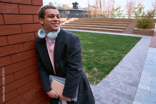 Handsome young African American student enjoying a stylish day in the city