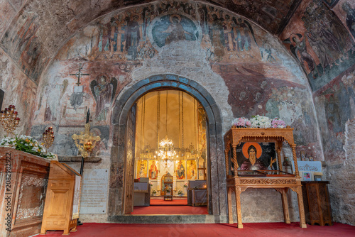 Fotografía Interior of Mileseva Monastery showing medieval frescoes, orthodox altar, and holy relics