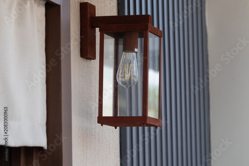 Fotografie Close-up of a traditional lantern fixture on a modern home exterior wall