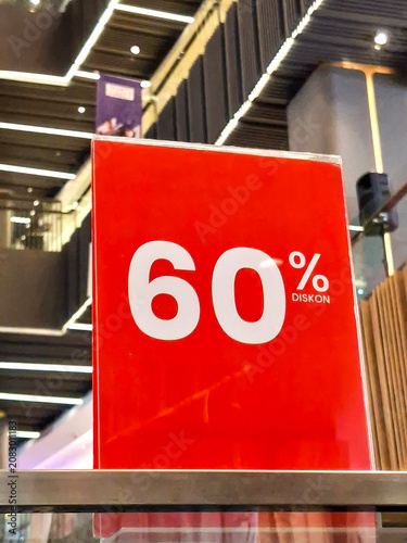 close-up shot of a bright red promotional sign displaying a 