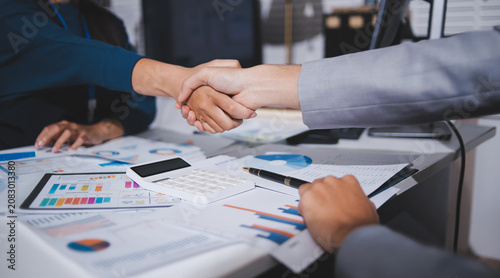 Handshake, hiring and contract with people in office for collaboration, teamwork and thank you. Meeting, B2B and welcome with employee shaking hands for partnership, networking and job promotion