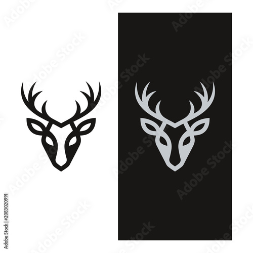 Deer head with antlers on white and black backgrounds icon