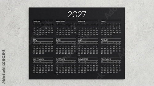 2027 calendar on black background. Minimalist yearly planner for business scheduling.