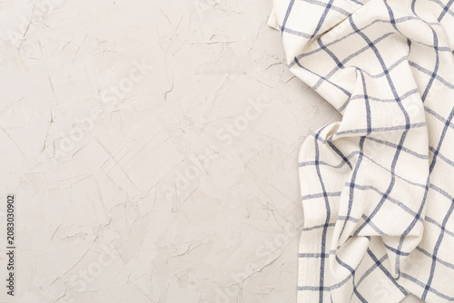 Kitchen napkin on concrete background, top view