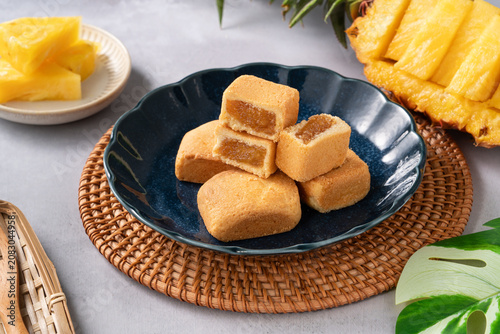 Traditional Taiwanese pineapple cake pastry served on ceramic plate.