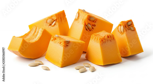 Fresh pumpkin chunks with seeds, isolated on a pure white background
