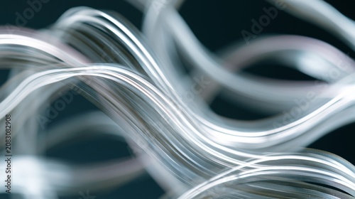 Long exposure abstract image of flowing light trails creating dynamic wave patterns against a dark background, showcasing motion and fluidity in a visually striking manner
