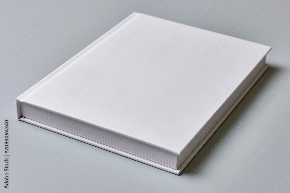Fototapeta premium The Blank White Book in a Minimalist Studio Setting for Photography