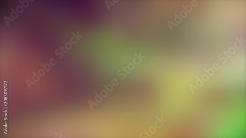 Blurry multicolored abstract background with purple, green, and yellow hues