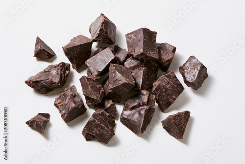 The Dark Chocolate Chunks Scattered on White Background for Gourmet Indulgence