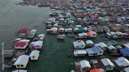 Traditional Bajau Laut Village, Sea Gypsy people in Semporna, Borneo, Malaysia. Stilt Houses Above Sea Waters