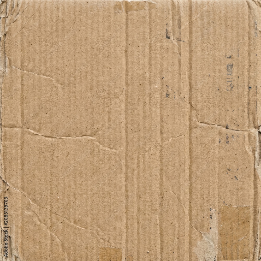 Fototapeta premium Brown cardboard paper texture background with creases and tears