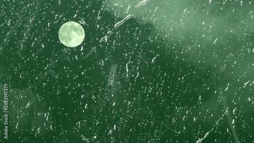 Close-up of Rain and Lightning Storm with Green Background in Motion
